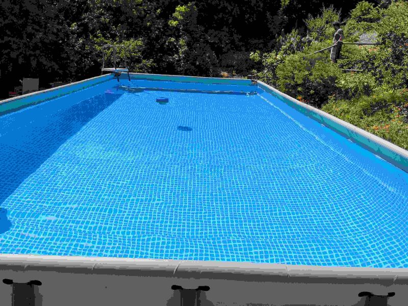 Rectangular above-ground pool with clear blue water